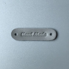 Світло-сіра шкіряна бирка Hand made, 45×12 мм